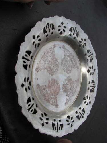 A PLATED TRAY WHICH IS PIERCED WITH INTRICATE DESIGN @CRRAAAZY R1 START