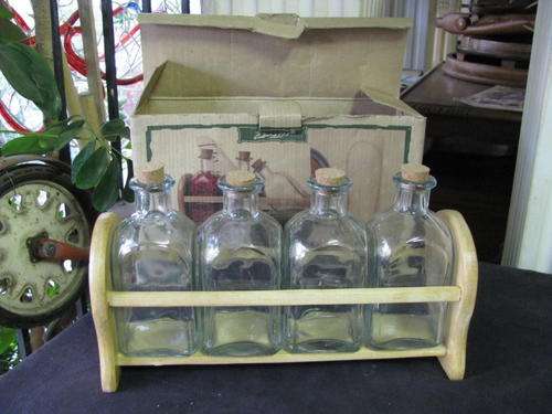A SET OF 4 KITCHEN STORAGE BOTTLES ON WOODEN RACK   @@@ CRAZY LOW START