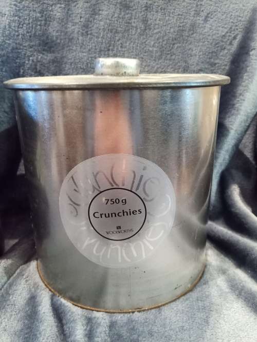 Lot including Vintage Louiesenhof Perroquet stoneware bottle and Large Crunchies tin