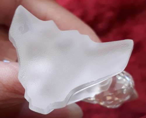 A SWAROVSKI SILVER CRYSTAL BEE WITH FLOWER