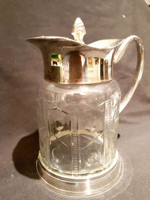 Pressed and cut glass jug with silver plated top and bottom - A magnificent piece!! Bid now!
