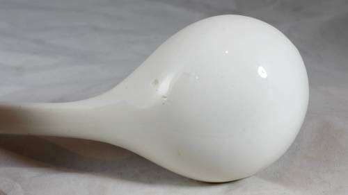 Large white serving spoon