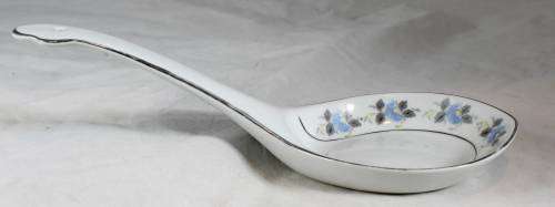 Large white serving spoon