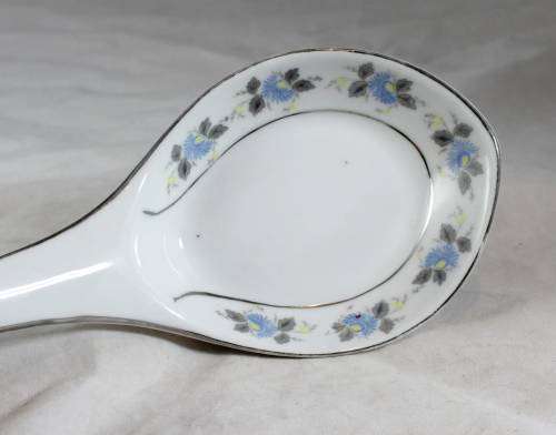 Large white serving spoon