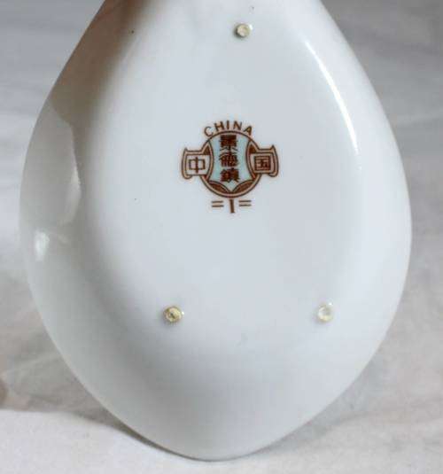 Large white serving spoon