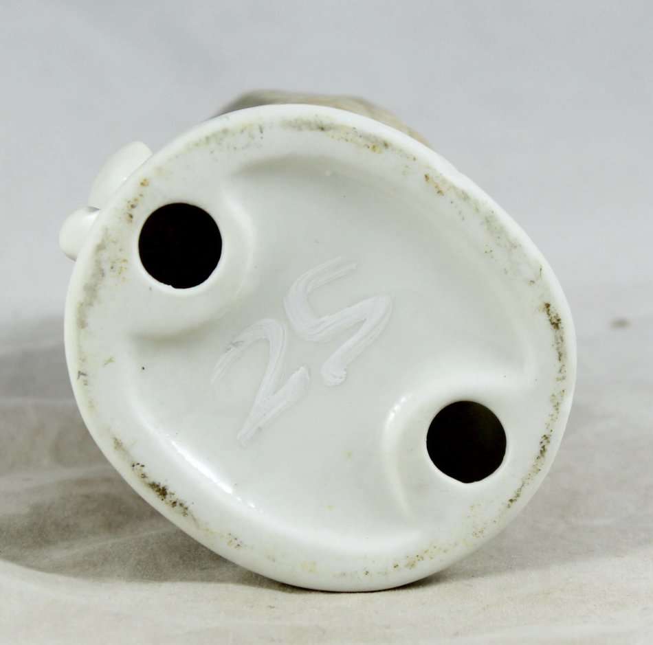 Porcelain owl on tree stump