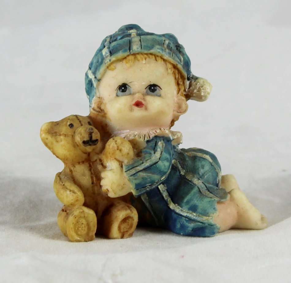 Small baby with teddy bear