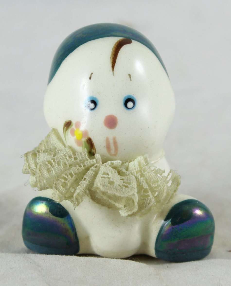 Small porcelain baby with lace collar - green pearl