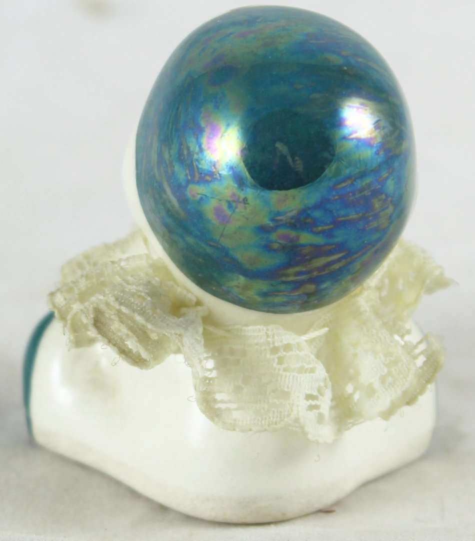 Small porcelain baby with lace collar - green pearl