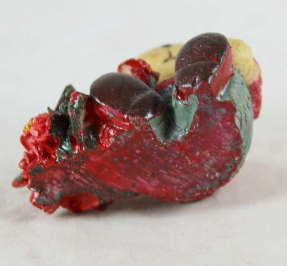 Small bear holding bunch of roses