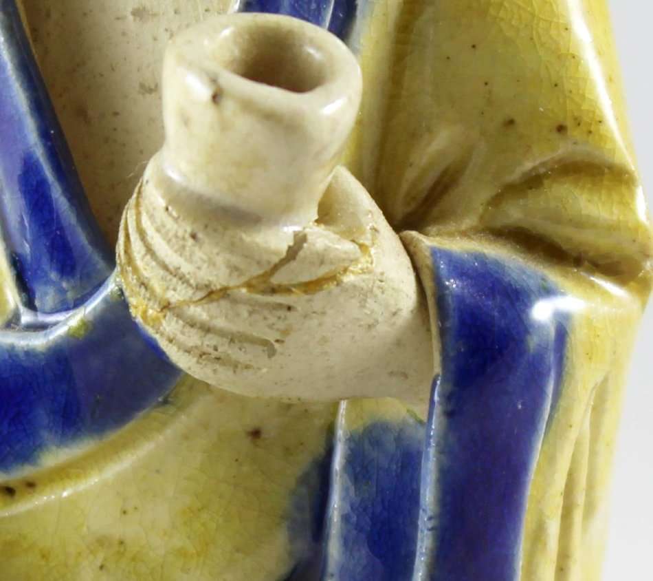 Mud man with big green pot