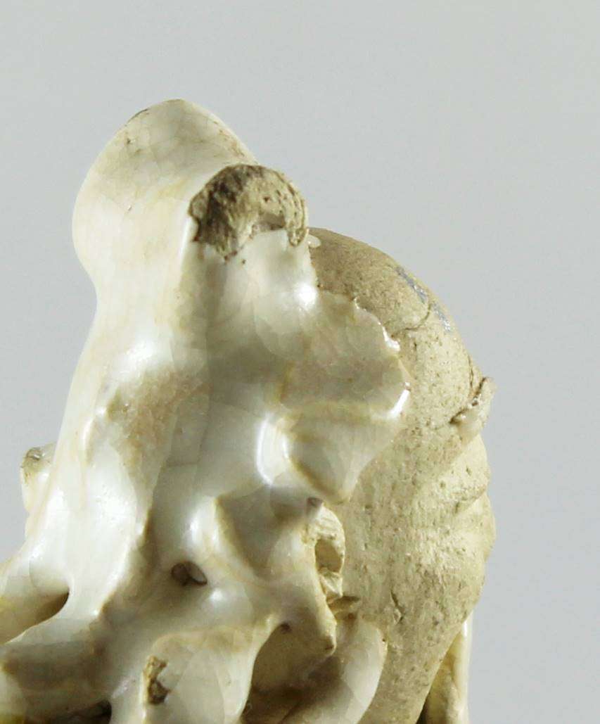 Mud man with big green pot