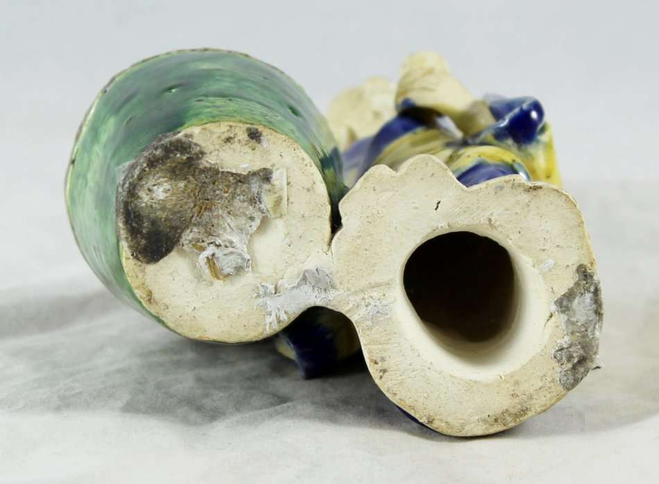 Mud man with big green pot