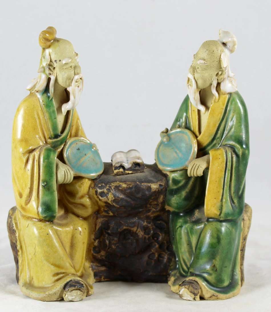 Mud man sitting and conversing