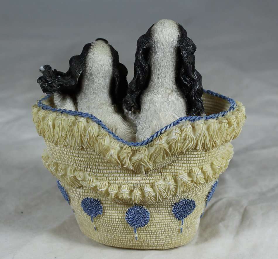 Cocker Spaniel puppies in a basket