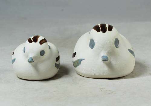 Blue and brown bird figures