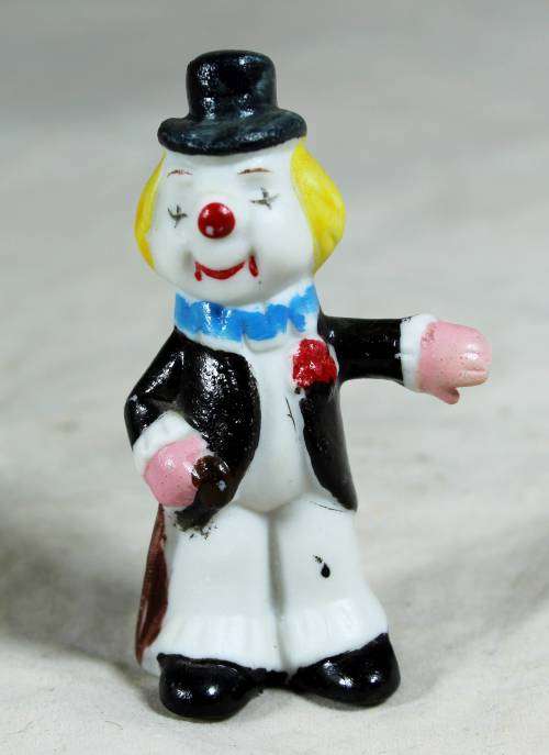 Miniature clown showing the way
