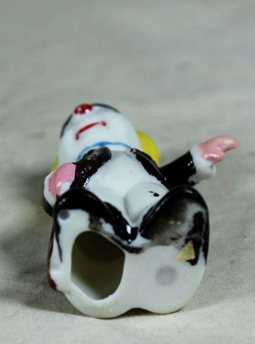 Miniature clown showing the way