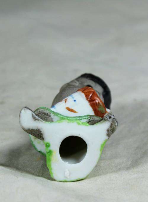 Miniature boy with an African drum