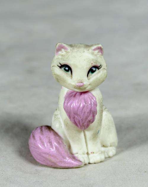 Miniature cat with pink tail