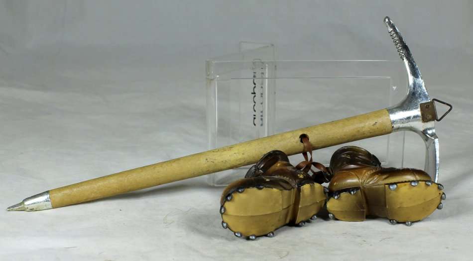 A  PICK WITH A PAIR OF PLASTIC BOOTS - BID NOW!!!