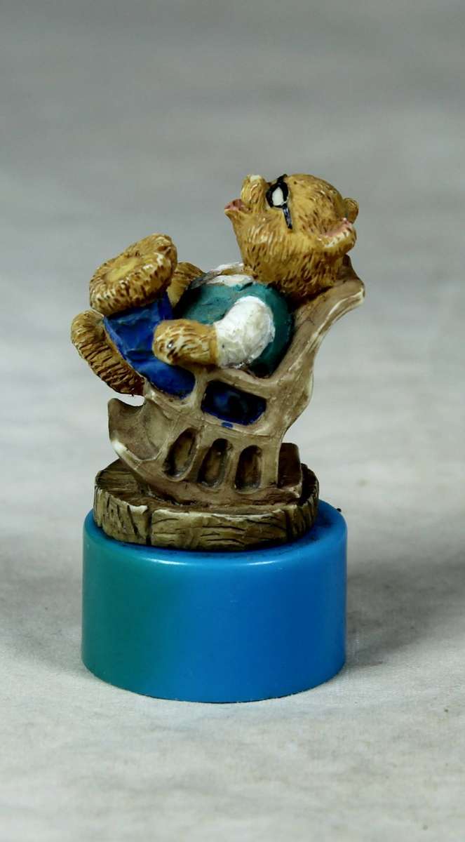 Miniature bear in a rocking chair