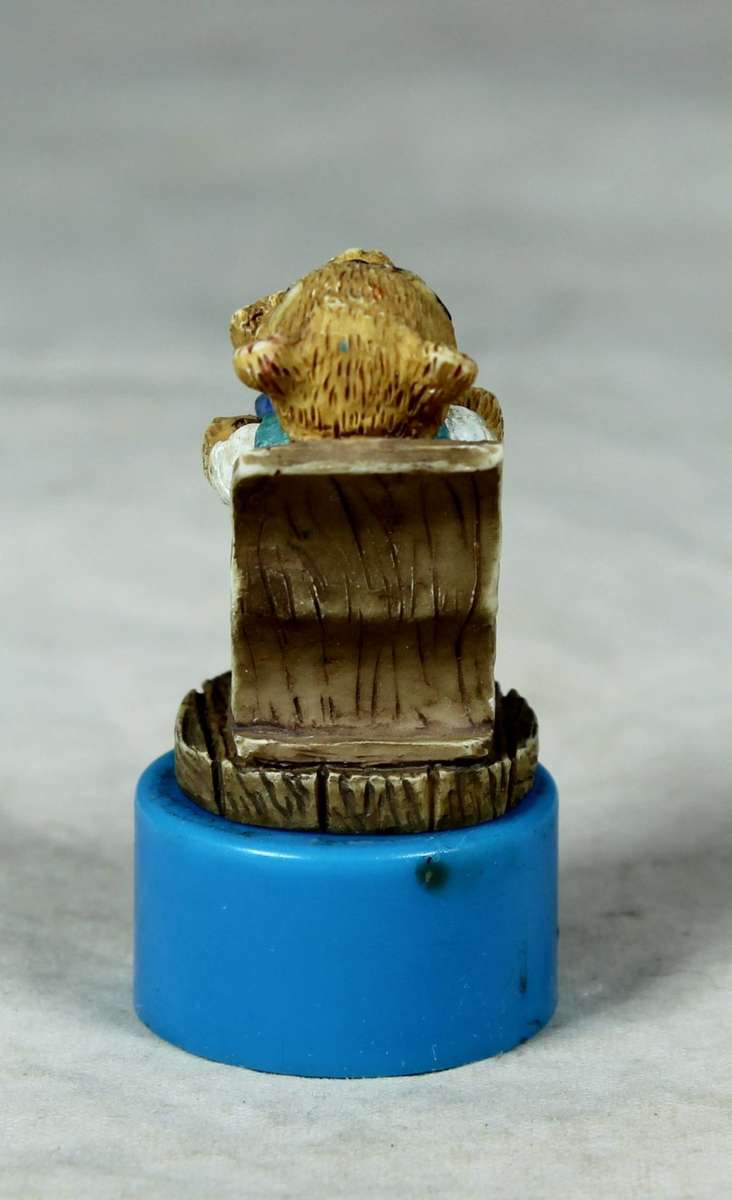 Miniature bear in a rocking chair