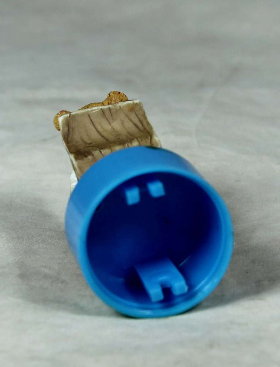 Miniature bear in a rocking chair