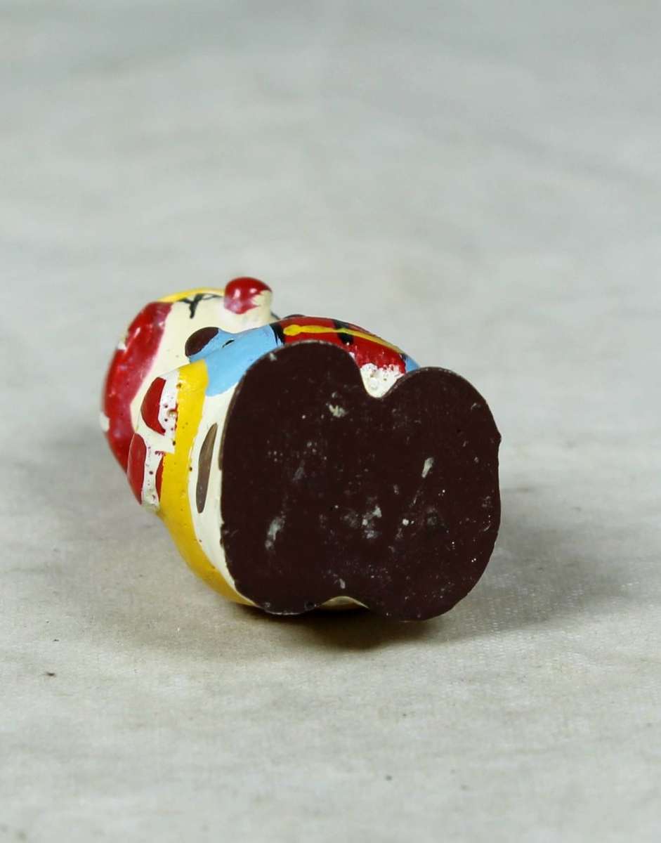 Miniature clown with a sad face