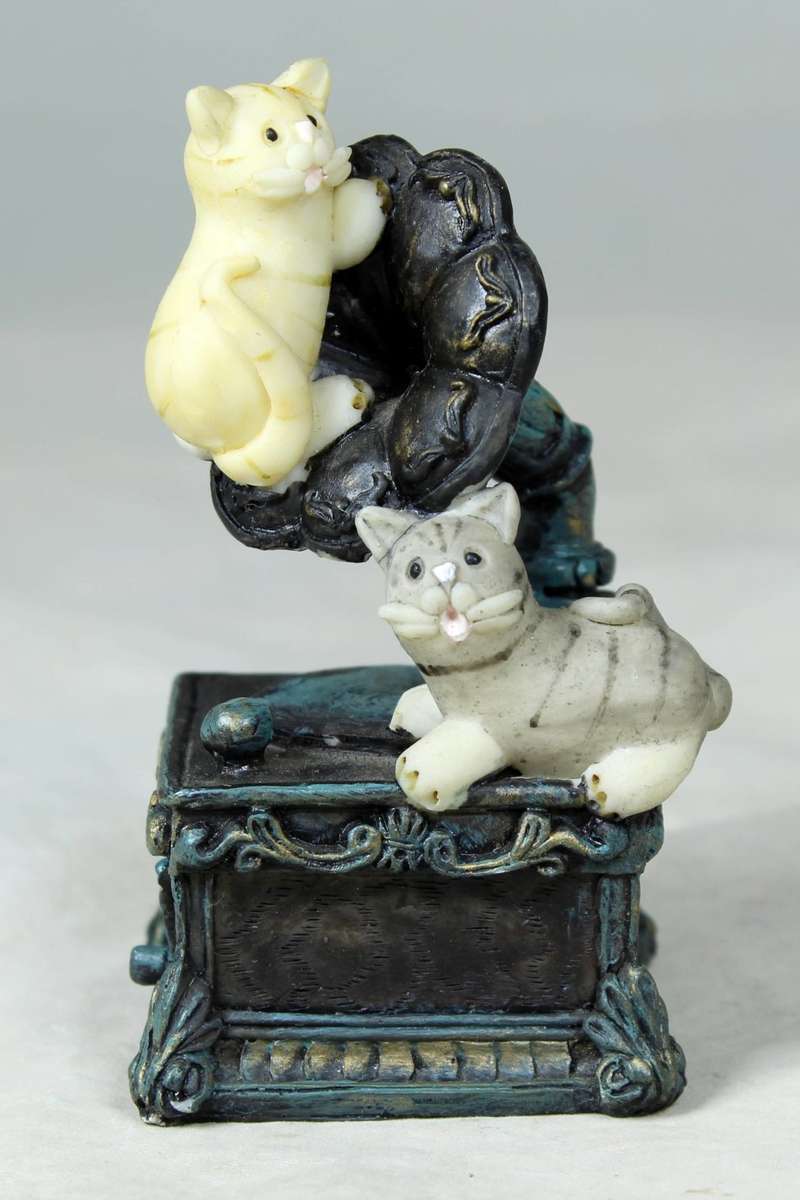 Cats playing on an old gramophone