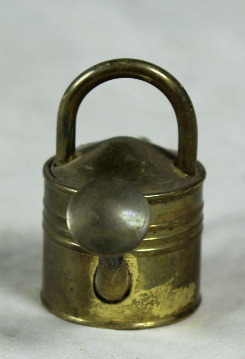 Miniature brass watering can