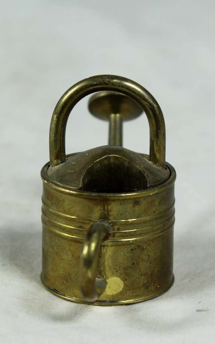 Miniature brass watering can