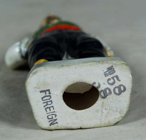 Vintage porcelain figurine - man in traditional clothes #58