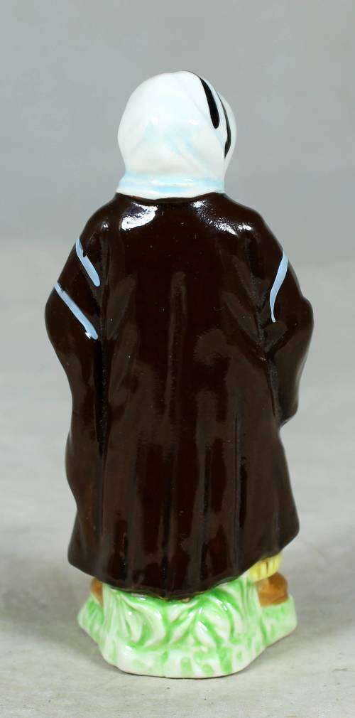 Vintage porcelain figurine - man in traditional clothes #60