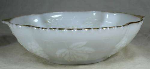 Milk glass bowl with grapes and a gold rim
