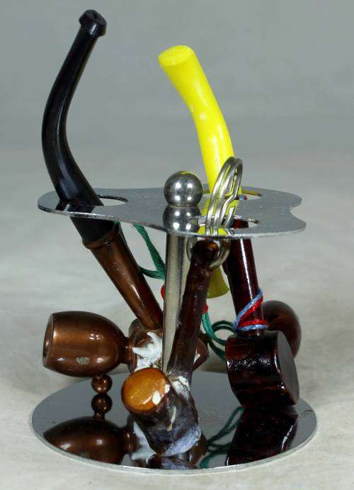 SMALL COLLECTION OF PIPES ON A STAND-BID NOW