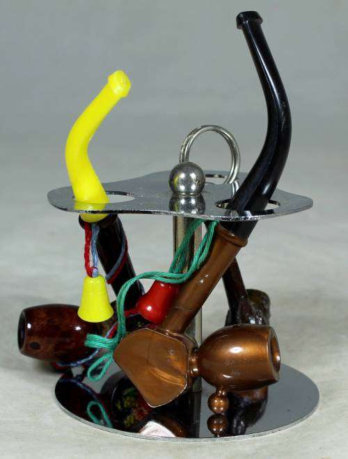 SMALL COLLECTION OF PIPES ON A STAND-BID NOW