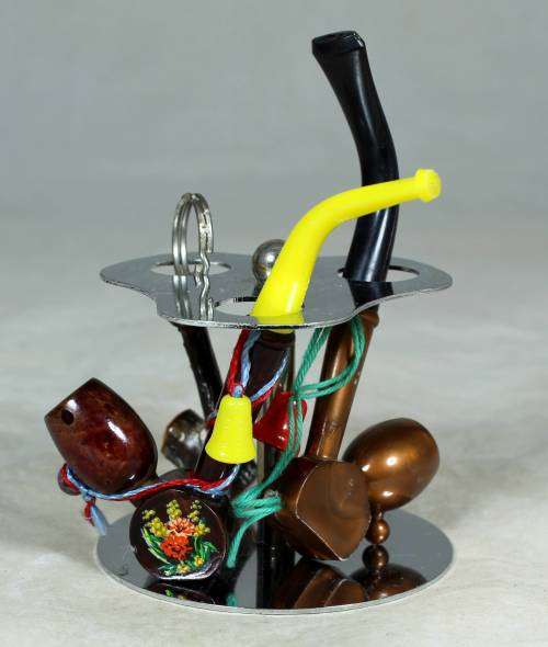 SMALL COLLECTION OF PIPES ON A STAND-BID NOW