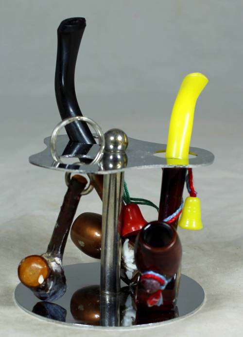 SMALL COLLECTION OF PIPES ON A STAND-BID NOW