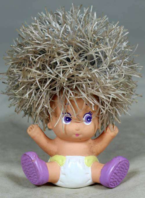 Rary dyper baby with large hair