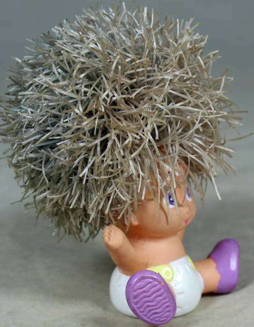 Rary dyper baby with large hair