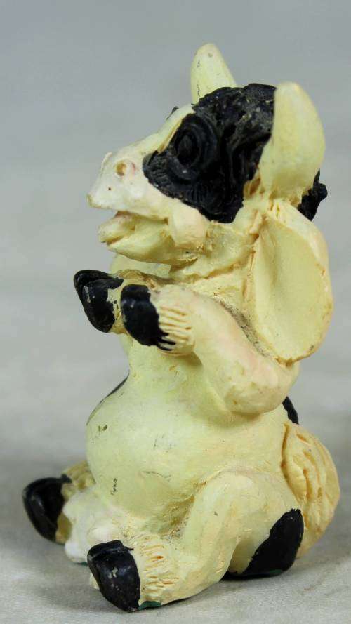 MINIATURE-MOLDED COW SITTING(LOVELY)BID NOW!!!!