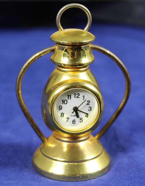 EXQUISITE HACHETTE MINIATURE METAL CLOCK WITH BOOKLET-MINERS LANTERN BID NOW!!