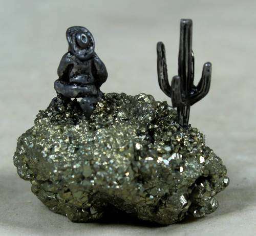 Miniature cowboy on a semi-precious rock