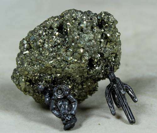 Miniature cowboy on a semi-precious rock