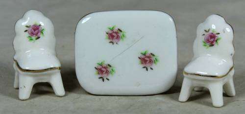 MINIATURE-MINIATURE PORCELAIN TABLE AND 2 CHAIRS BID NOW!!