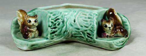 Log vase with squirrels