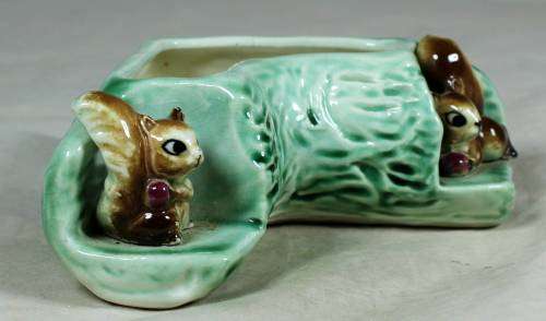 Log vase with squirrels