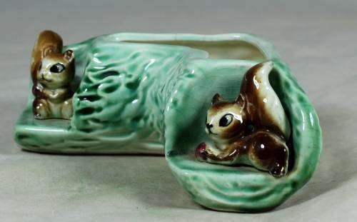 Log vase with squirrels
