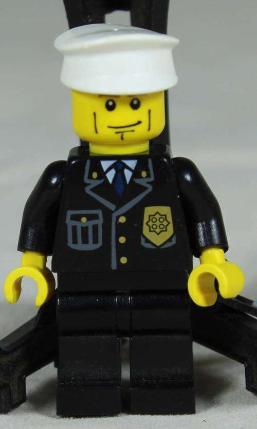 LEGO MINI FIGURINE-POLICEMAN WITH A WHITE HAT BID NOW